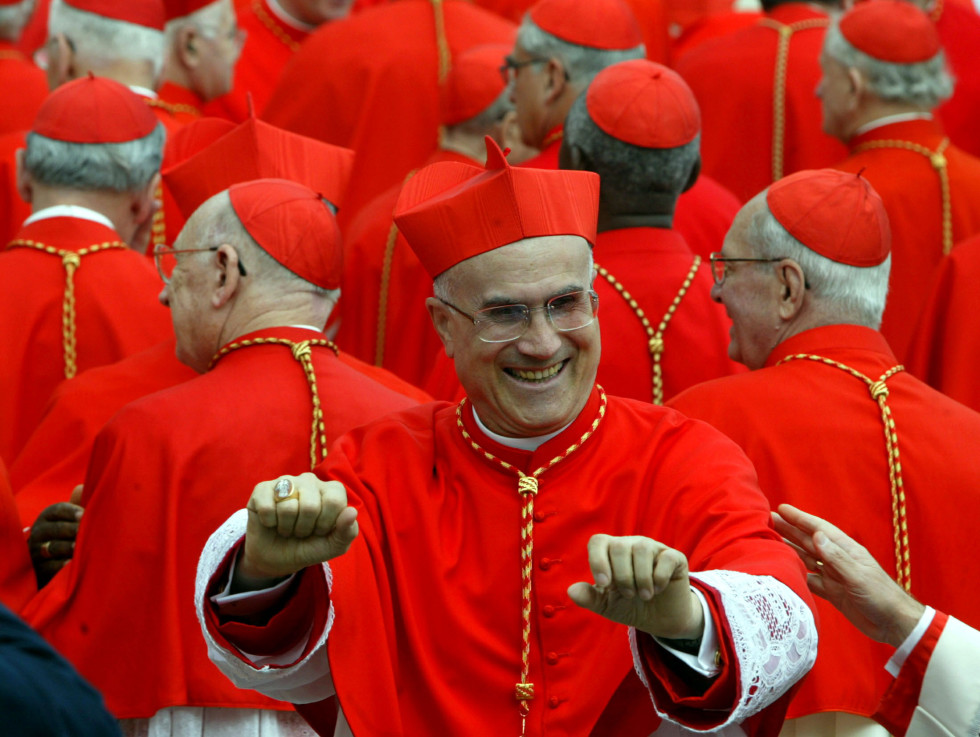 File photo of newly elevated Cardinal Bertone of Italy celebrating after the consistory led by Pope John Paul II in Saint Peter's Square at the Vatican