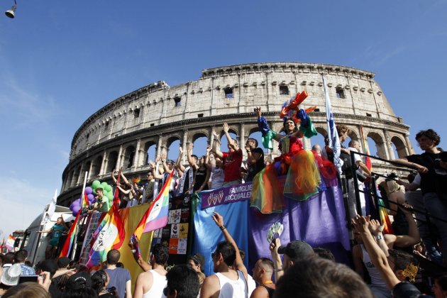 Demonstrators make their way past the Colosseum during the Europride gay rights march in Rome, Saturday, June 11, 2011. The Europride parade, held every year in a different European city, ends Saturday evening in Circus Maximus, a grassy field where ancient Romans would gather for entertainment, where Lady Gaga is expected to sing 